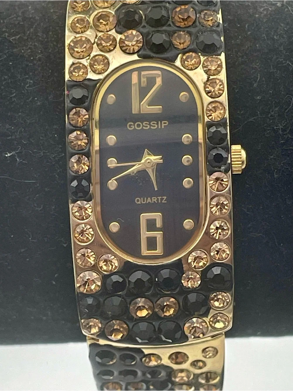Gossip Gold-Tone Black and Champagne Crystal Bangle Watch. In original box.